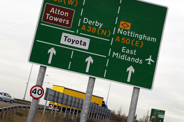 Business week: Road sign showing Toyota