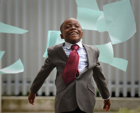 GCSE results: Seven year old Jude Alli from London celebrates his GCSE maths pass