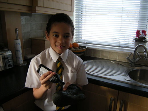 CAFOD: This is me polishing my shoes. It is a chore! Yoshi, aged 9