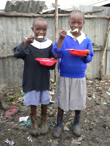 Kenya food crisis: Porridge pair: schoolgirls enjoy their Marys Meal
