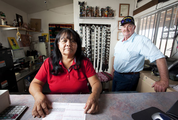 Route 66 Day 3: Ben Hatch and Emma Yazzi in the Dollar Pawn Shop,  Winslow, Arizona