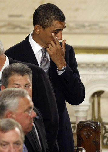Edward Kennedy funeral: President Barack Obama wipes his eye at the funeral