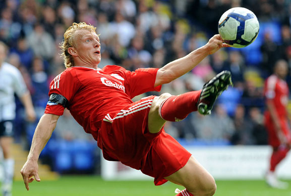 premier league: Liverpool's Dirk Kuyt clears the ball