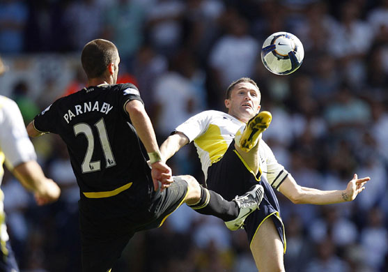 premier league: Spurs' Robbie Keane and Birmingham's Stuart Parnaby high kick for the ball
