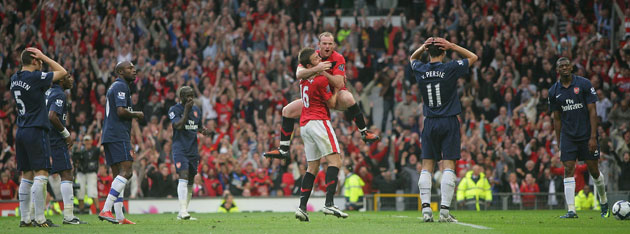 Prem 2: Rooney celebrates amongst dejected Arsenal players