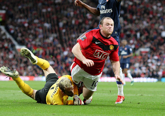 Prem 2: Wayne Rooney is brought down by Arsenal's Manuel Almunia for a penalty 
