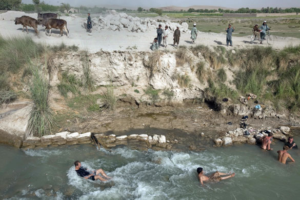 Sean Smith Helmand: British troops cool off in a canal after moving south from FOB Jakers