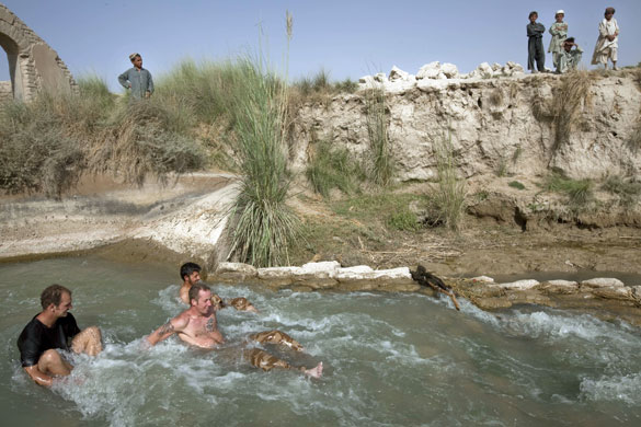 Sean Smith Helmand: British troops cool off in a canal after moving south from FOB Jakers