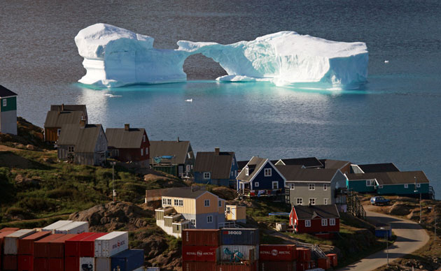 24 hours in pictures : An iceberg floats near a harbour in the town of Kulusuk, east Greenland
