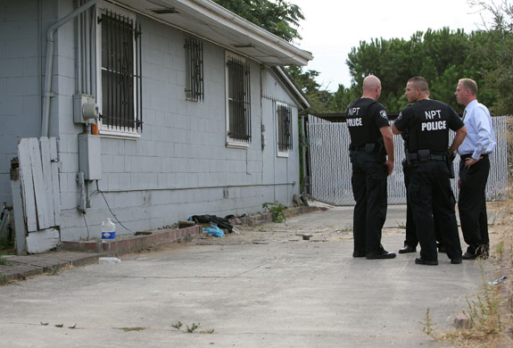 Jaycee Dugard kidnapping: Police officers stand in front of the home of Phillip Garrido