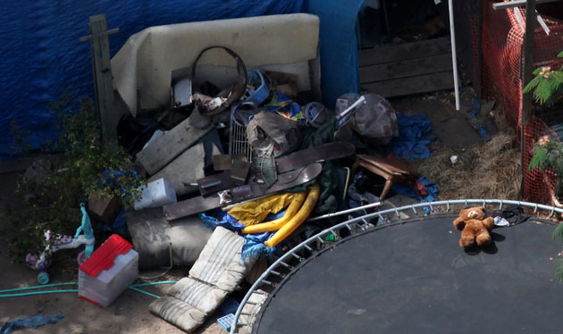 Jaycee Dugard kidnapping: Children's toys sit amongst debris in the backyard of Phillip Garrido