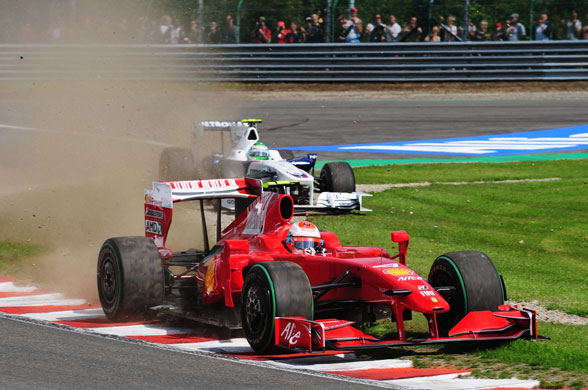 Belgian Grand Prix: Kimi Raikkonen of Ferrari drives through Les Combes corner