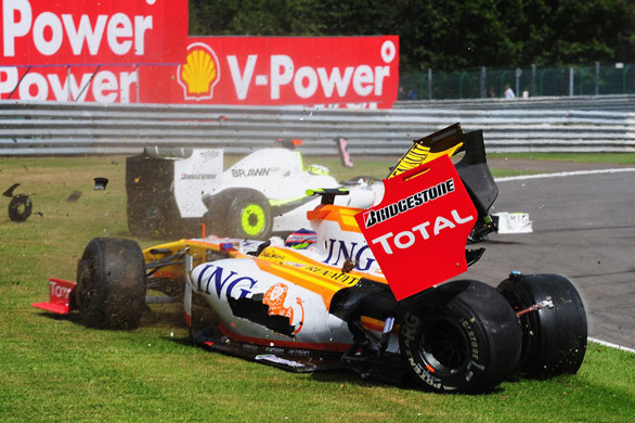 Belgian Grand Prix: Romain Grosjean (front) of Renault and Jenson Button of Brawn GP collide