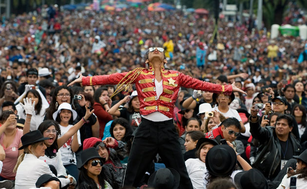 24 hours in pictures: Mexico City, Mexico: Hector Jackson takes part in a mass Thriller dance