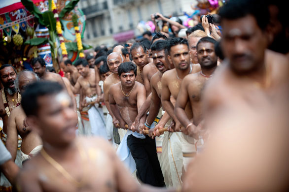 24 hours in pictures: Paris, France: People parade to celebrate the Hindu deity Ganesh