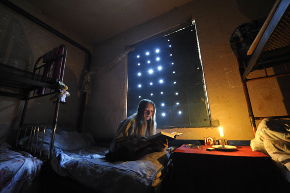 24 hours in pictures: Alapayevsk, Russia: A drug user reads a book in a rehabilitation centre