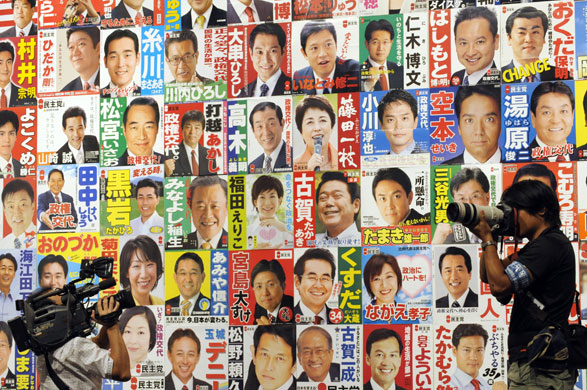 24 hours in pictures: Tokyo, Japan: Members of the media prepare to report on the election 