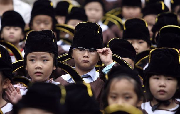 24 hours: Children attend a ceremony at a temple of Confucius in Nanjing