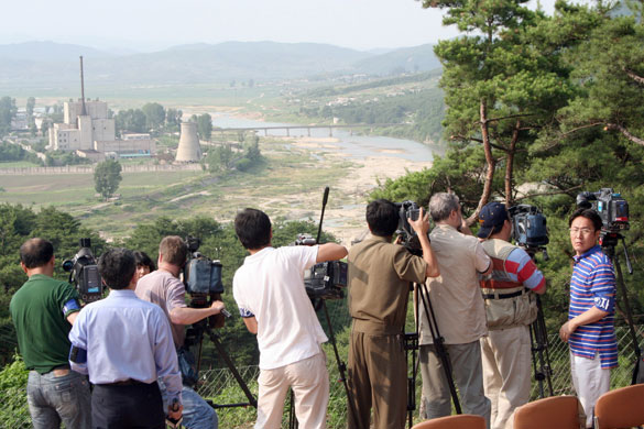 Korea and the US: 2008: TV crews film the demolition of the Yongbyon nuclear cooling tower