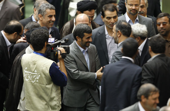Ahmadinejad inauguration: President Mahmoud Ahmadinejad is surrounded by lawmakers and media