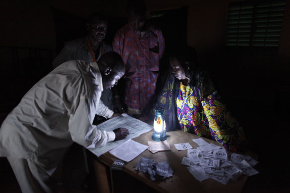 5 August 2009: Niamey, Niger: Poll workers tally yes and no ballots 