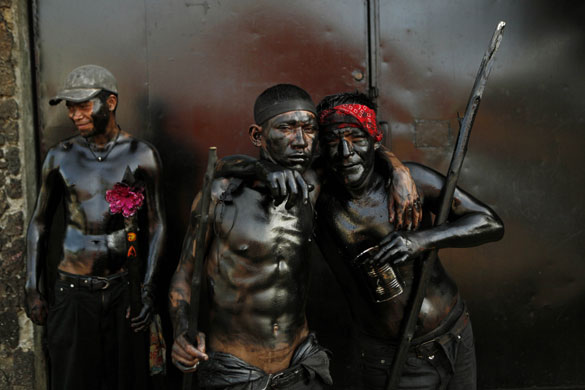 5 August 2009: Managua, Nicaragua: Men, with their bodies painted with recycled oil