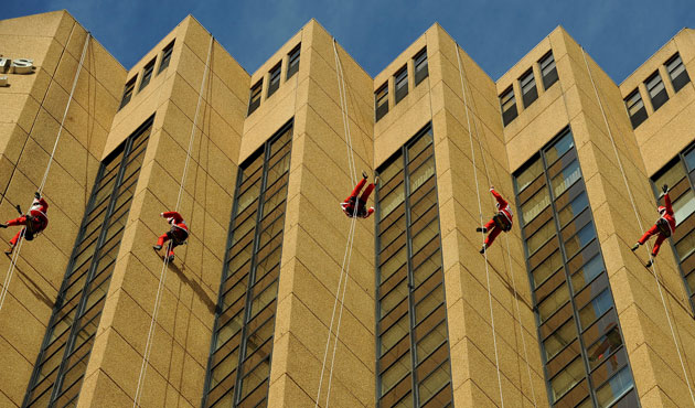 5 August 2009: Sydney, Australia: Santas from 'Variety - The Children's Charity' abseil