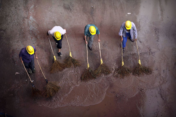 5 August 2009: Shanghai, China: Migrant construction workers