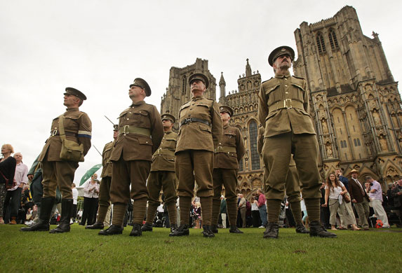 Harry Patch funeral: Men dressed as First World War soldiers stand outside Wells Cathedral 