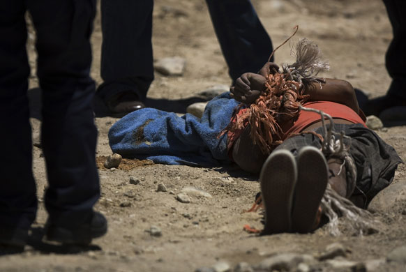 7 August 2009: Tijuana, Mexico: A man lies dead with his wrists and ankles tied