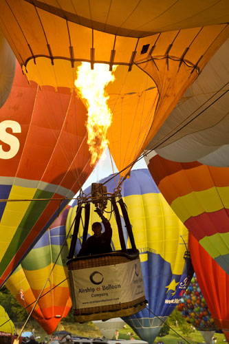 Bristol balloon festival: A hot air balloon pilot activates the burners