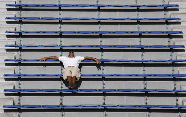 Weirdsport: A fan rests in the stands
