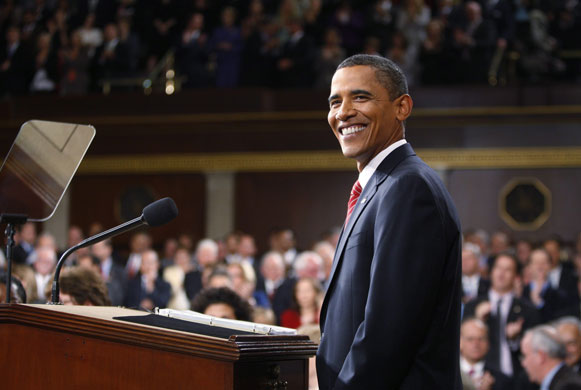 Barack Obama healthcare: Barack Obama smiles as he pauses while delivering a speech on healthcare