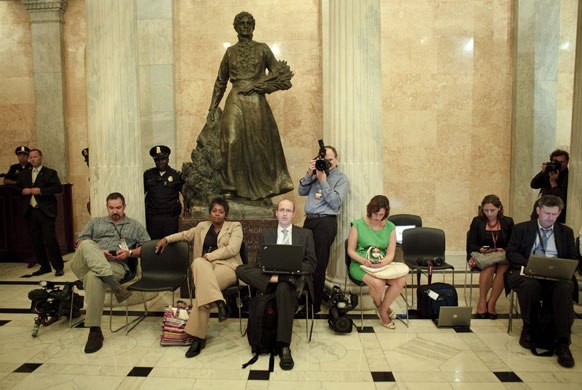 Barack Obama healthcare: Members of the White House press corps listen on Capitol Hill