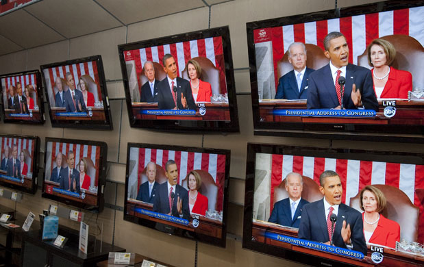 Barack Obama healthcare: Television screens at a Best Buy store in Omaha