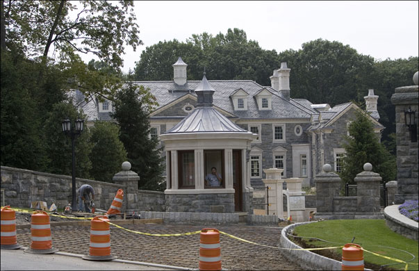 Alpine New Jersey: Workers outside one of the many mansions in Alpine. 