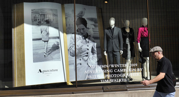 Week in Business: A man walks past the flagship Aquascutum store in London. 