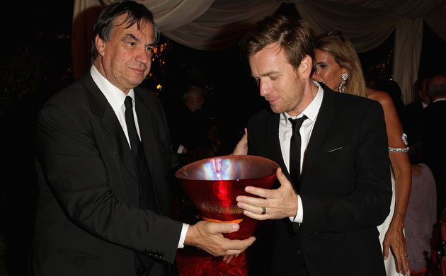 Venice film festival: Ewan Mcgregor (R) receives a Murano vase from Mauro Pizzigati