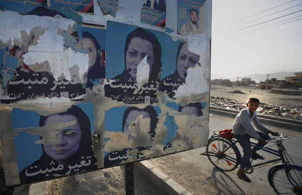 24 hours in pictures: Kabul, Afghanistan: defaced election posters