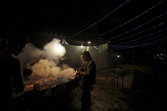 24 hours in pictures: Jerusalem: Palestinians buy kebabs before sunrise during the Ramadan 