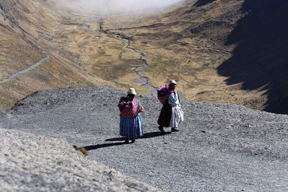 24 hours in pictures: Yanacahi, Bolivia: Two women walk along the Camino El Choro