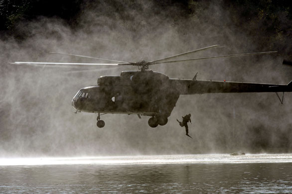 24 hours in pictures: Ercsi, Hungary: A military diver jumps from a helicopter 
