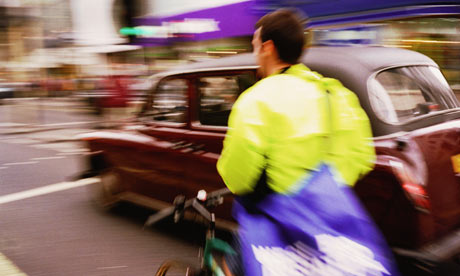 Bike blog: Bicycle courier riding in traffic