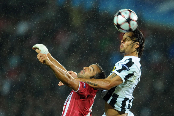 3 champions league: Juventus' Amauri holds down Bordeaux's Marc Planus in order to win a header