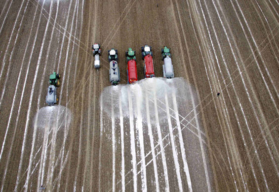 24 hours in pictures: Belgian milk producers dump milk