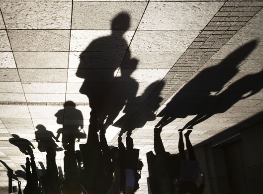 Week in Business: The shadows of shoppers outside Harvey Nichols store in Edinburgh