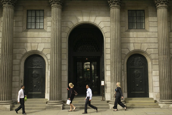 Week in Business: People walk past the Bank of England in the City of London.