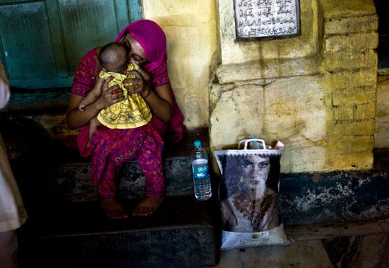24 hours in pictures: Indian Muslim woman kisses her son during the holy Muslim month of Ramadan