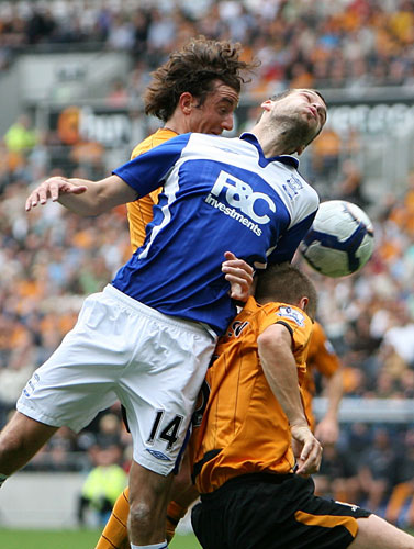 Saturday Premiership : Birmingham City's Roger Johnson with Hull City's Andy Dawson & Stephen Hunt
