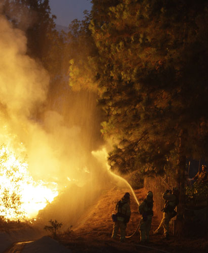 Wildfires California: Firefighters work a fire threatening houses in the La Crescenta section